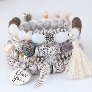 Boho Cream And Silver Stacked Beaded Bracelets With Wing And Tassel